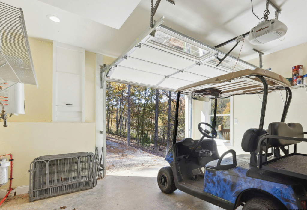 The inside of a garage that the door is open.